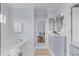 Spa-like bathroom featuring a soaking tub, double vanity, and neutral color palette at 2489 Daniel Island Dr, Daniel Island, SC 29492