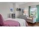Bright bedroom featuring an armchair, TV, and decor with a window view at 2489 Daniel Island Dr, Daniel Island, SC 29492