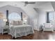Bright bedroom with accent window, ceiling fan, sitting chair, and decor at 2489 Daniel Island Dr, Daniel Island, SC 29492
