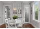 Cozy dining area with a white table, chairs, built-in cabinetry, and a view to the pantry at 2489 Daniel Island Dr, Daniel Island, SC 29492