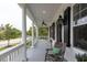 Charming front porch with classic railings and ample space for outdoor enjoyment at 2489 Daniel Island Dr, Daniel Island, SC 29492