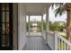 Charming front porch with view of a beautifully landscaped yard and neighboring home at 2489 Daniel Island Dr, Daniel Island, SC 29492
