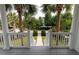 View of well-manicured front yard with lush landscaping from the porch at 2489 Daniel Island Dr, Daniel Island, SC 29492