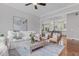 Bright living room with hardwood floors, stylish furnishings, and an open view to the kitchen at 2489 Daniel Island Dr, Daniel Island, SC 29492
