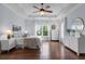 Bright main bedroom features a tray ceiling, hardwood floors, and lots of natural light at 2489 Daniel Island Dr, Daniel Island, SC 29492