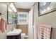 Bathroom featuring a sink, medicine cabinet, and shower with a curtain, perfect for everyday use at 2631 Ridgewood Ave, Charleston, SC 29414