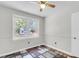 Light-filled room with windows overlooking the backyard, and neutral walls with white trim at 2631 Ridgewood Ave, Charleston, SC 29414