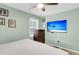 Charming bedroom with ceiling fan, modern TV, wood dresser, and natural light from the window at 2631 Ridgewood Ave, Charleston, SC 29414