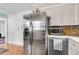 Kitchen area featuring stainless steel refrigerator and efficient microwave, great for cooking at 2631 Ridgewood Ave, Charleston, SC 29414