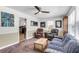 Comfortable living room with a ceiling fan, rug, and access to the kitchen, ideal for entertaining at 2631 Ridgewood Ave, Charleston, SC 29414