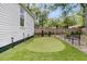 Beautiful backyard with a putting green, lush greenery, and a relaxing outdoor space at 2666 Poplin Ave, North Charleston, SC 29405