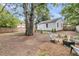 Inviting backyard with a fire pit, comfortable seating, and a serene outdoor setting at 2666 Poplin Ave, North Charleston, SC 29405