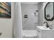 Updated bathroom featuring modern vanity, toilet, and shower with marble-look tile at 2666 Poplin Ave, North Charleston, SC 29405