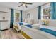 Charming bedroom featuring twin beds with stylish bedding and a ceiling fan at 2666 Poplin Ave, North Charleston, SC 29405