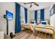 Bedroom featuring twin beds with stylish bedding, streaming television, and view to windows at 2666 Poplin Ave, North Charleston, SC 29405