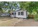 Well-maintained home with a nice front lawn and tidy landscaping at 2666 Poplin Ave, North Charleston, SC 29405