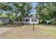 Home with a nice front yard, sidewalk, and charming front porch at 2666 Poplin Ave, North Charleston, SC 29405