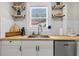 Bright kitchen featuring open shelving, butcher block countertops, white subway tile, and stainless steel appliances at 2666 Poplin Ave, North Charleston, SC 29405