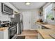 Spacious kitchen featuring stainless steel appliances, butcher block countertops, and modern cabinetry at 2666 Poplin Ave, North Charleston, SC 29405