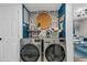Convenient laundry room featuring updated appliances, stylish decor, and ample storage at 2666 Poplin Ave, North Charleston, SC 29405
