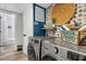 Well-lit laundry room showcasing modern appliances, trendy accents and functional design at 2666 Poplin Ave, North Charleston, SC 29405