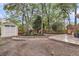 Large backyard with a storage shed, wooden deck with outdoor seating, and lush landscaping, perfect for outdoor living at 2727 4 Winds Pl, Mount Pleasant, SC 29466