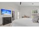 Spacious bedroom with an open closet, accent wall, and large television at 2727 4 Winds Pl, Mount Pleasant, SC 29466