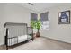 Charming bedroom with neutral carpet, contrasting black crib, and window with natural light at 2727 4 Winds Pl, Mount Pleasant, SC 29466