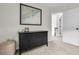 Bedroom featuring black dresser, nautical art, and bright white door with stairs to another level at 2727 4 Winds Pl, Mount Pleasant, SC 29466