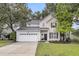 Charming two-story home featuring a well-manicured lawn, a two-car garage, and classic curb appeal at 2727 4 Winds Pl, Mount Pleasant, SC 29466