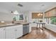 Bright eat-in kitchen area with a wooden table, stainless steel appliances, and natural light at 2727 4 Winds Pl, Mount Pleasant, SC 29466