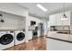 Well-equipped kitchen featuring stainless steel appliances, sleek cabinetry, and a convenient laundry area at 2727 4 Winds Pl, Mount Pleasant, SC 29466