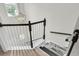 Elegant staircase with a decorative chandelier and a combination of carpet and hardwood flooring at 2727 4 Winds Pl, Mount Pleasant, SC 29466