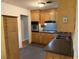 Kitchen featuring custom wood cabinetry, black countertops, and stainless steel appliances at 2734 Mona Ave, Charleston, SC 29414