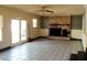 Spacious living room with a brick fireplace and white tiled floors at 2734 Mona Ave, Charleston, SC 29414