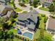 Aerial view of backyard pool, firepit and patio of a two-story home at 2981 Sturbridge Rd, Mount Pleasant, SC 29466