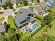 Aerial view of backyard pool, patio and screened-in porch of a two-story home at 2981 Sturbridge Rd, Mount Pleasant, SC 29466