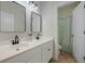 Bright bathroom features double vanity with black fixtures and framed mirrors over tile floors at 2981 Sturbridge Rd, Mount Pleasant, SC 29466