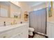 Bright bathroom with gold fixtures, vanity, and tub with shower at 2981 Sturbridge Rd, Mount Pleasant, SC 29466