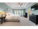 Spacious bedroom featuring trey ceiling, large windows, plush carpet and elegant decor at 2981 Sturbridge Rd, Mount Pleasant, SC 29466
