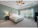 Inviting bedroom features a trey ceiling, bright windows, and elegant soft decor at 2981 Sturbridge Rd, Mount Pleasant, SC 29466