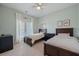 Shared bedroom features two twin beds, neutral tones and shared closet at 2981 Sturbridge Rd, Mount Pleasant, SC 29466