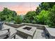 Cozy backyard fire pit area with stone pavers, perfect for outdoor entertaining and relaxation at 2981 Sturbridge Rd, Mount Pleasant, SC 29466