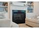 Bright living space with built-in shelves and a beautifully trimmed fireplace at 2981 Sturbridge Rd, Mount Pleasant, SC 29466