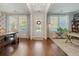Open-concept foyer featuring hardwood floors and bright natural light from front door at 2981 Sturbridge Rd, Mount Pleasant, SC 29466