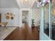 Bright and airy foyer with hardwood floors, modern decor, and a glimpse into the living spaces at 2981 Sturbridge Rd, Mount Pleasant, SC 29466