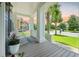 Spacious front porch with rocking chairs and a beautiful view of the landscaped yard at 2981 Sturbridge Rd, Mount Pleasant, SC 29466