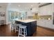 Beautiful kitchen with a blue island, white cabinets, breakfast bar, and modern appliances at 2981 Sturbridge Rd, Mount Pleasant, SC 29466