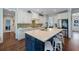 Bright kitchen featuring white cabinets, a contrasting blue island, and sleek countertops at 2981 Sturbridge Rd, Mount Pleasant, SC 29466