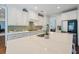Spacious kitchen with white cabinetry, a large center island, and mosaic tile backsplash at 2981 Sturbridge Rd, Mount Pleasant, SC 29466